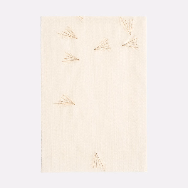 Ivory woven curtain fabric with sparse beige fan motifs and fine vertical texture