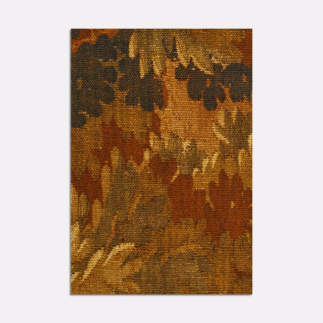 Warm russet and ochre woven curtain fabric with dark olive botanical forms