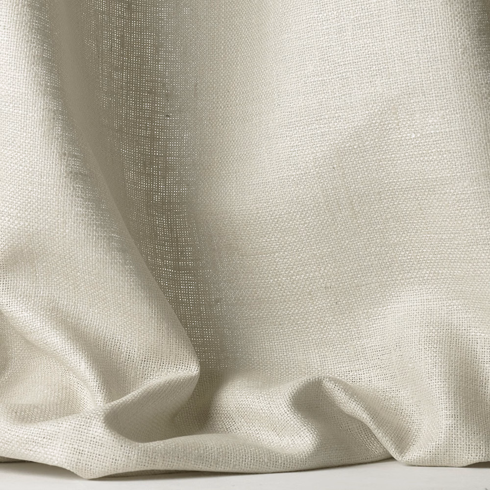 Warm ivory open-weave textile gathered into soft, fluid folds
