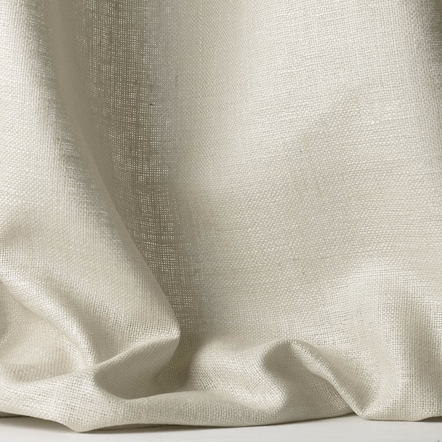 Warm ivory open-weave textile gathered into soft, fluid folds