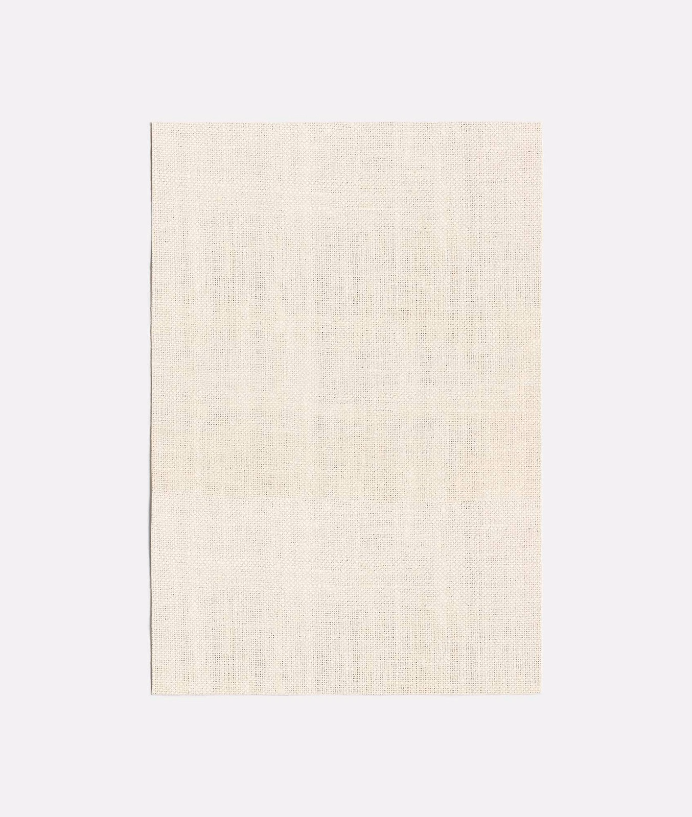 Pale ivory woven curtain fabric with fine vertical slubs and soft tonal depth