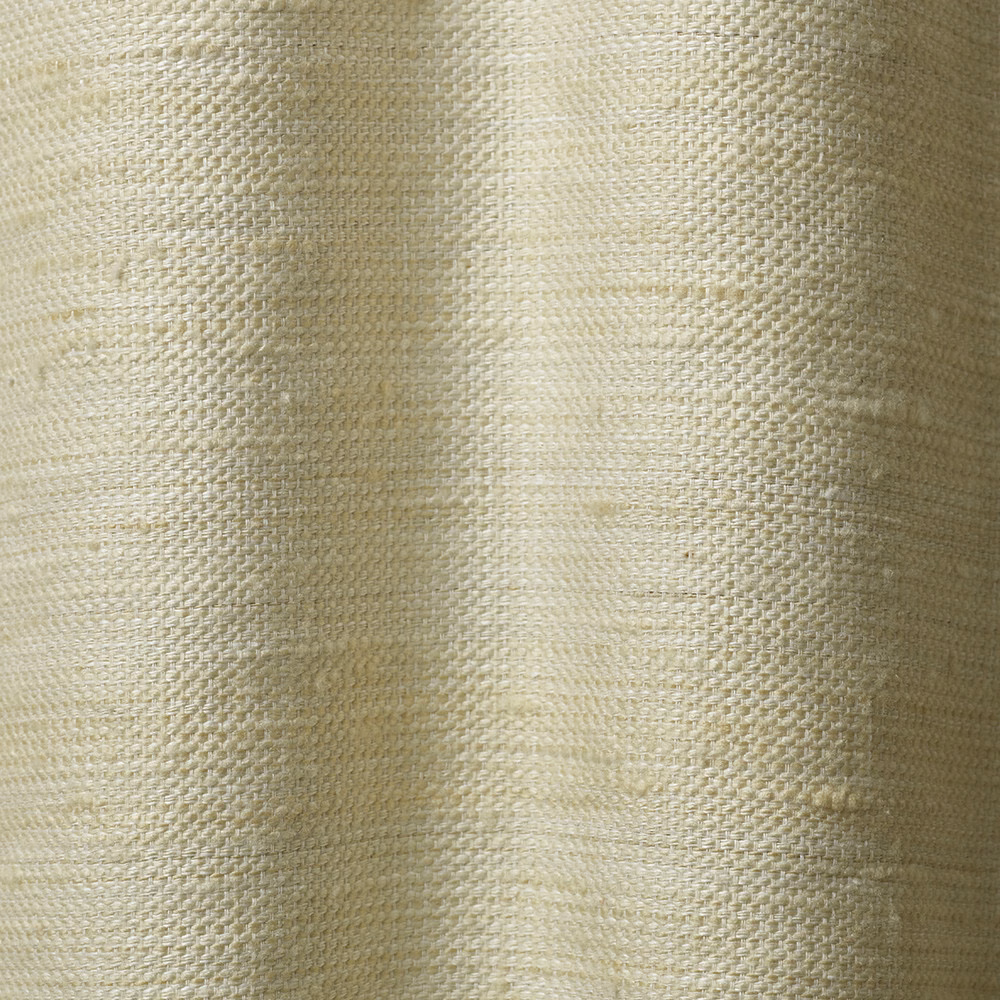 Pale ivory woven curtain fabric with softly irregular texture and vertical fold shading