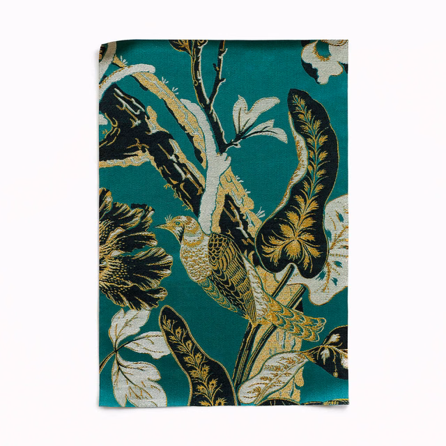 Deep teal jacquard with a bird, black leaves, cream flowers and gold accents