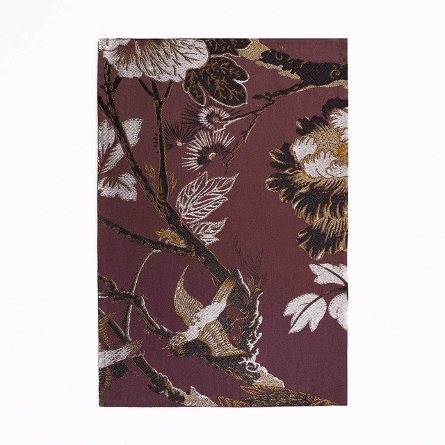 Deep plum jacquard with pale birds, branching stems and oversized botanical blooms