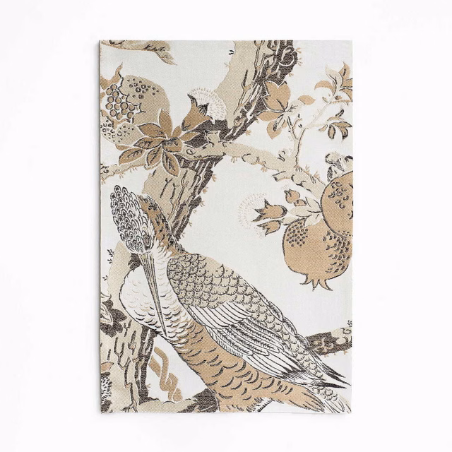 Ivory jacquard with a perched bird, branching foliage and muted taupe fruit motifs