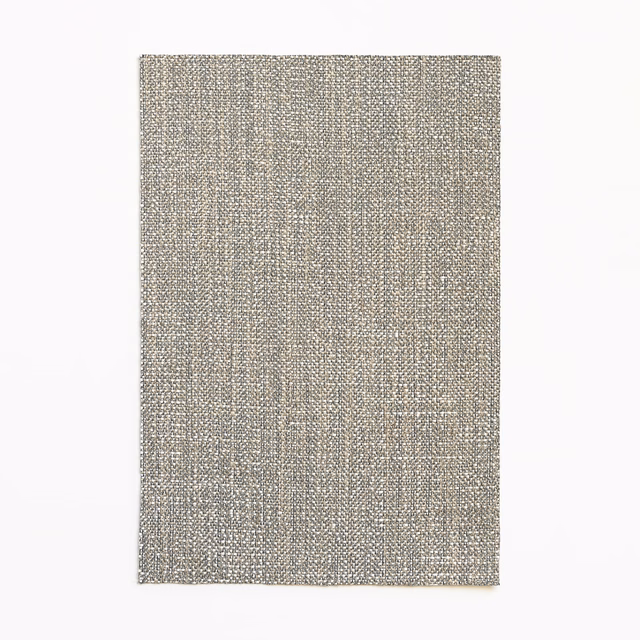 Cool greige woven textile with fine vertical striations and softly mottled silver depth