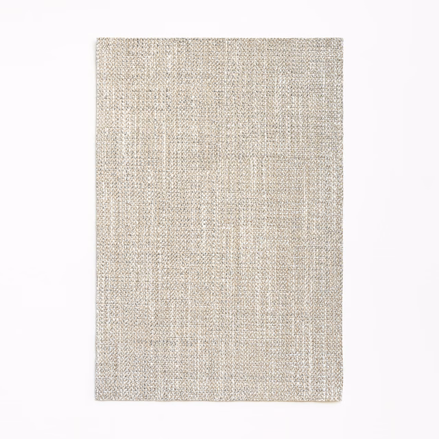 Pale greige woven curtain fabric with subtle vertical striations and flecked texture