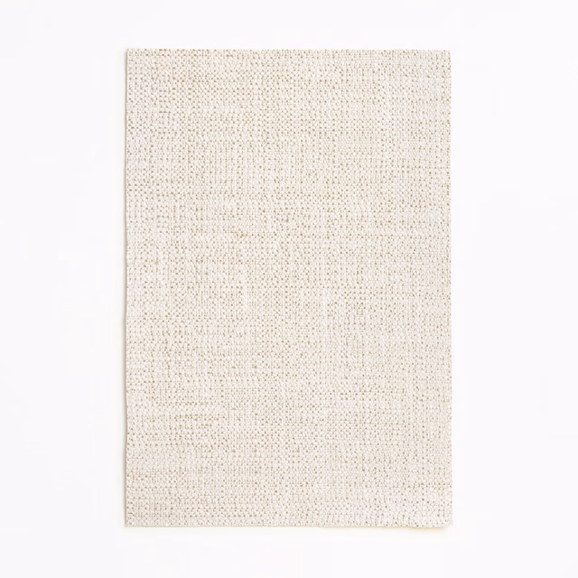 Warm ivory curtain fabric with a fine irregular woven texture and beige flecks