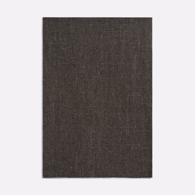 Deep charcoal-brown curtain fabric with a fine subtly crosshatched woven texture