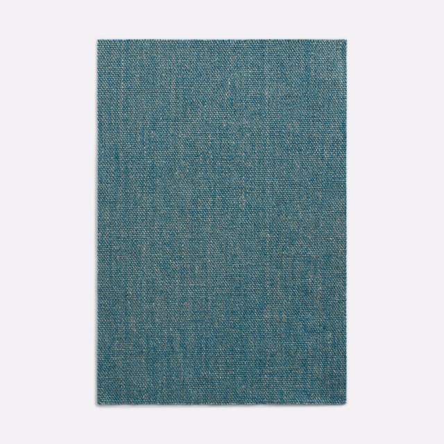 Fine woven swatch in muted blue teal with subtle pale mottling and crosshatch texture