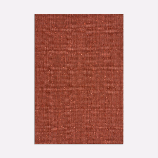 Deep marsala red curtain fabric with a fine vertical slub weave and subtle flecks