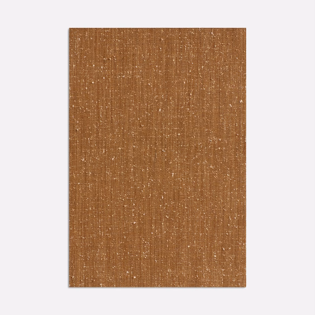 Nutty brown curtain fabric with fine vertical slubs and scattered pale flecks