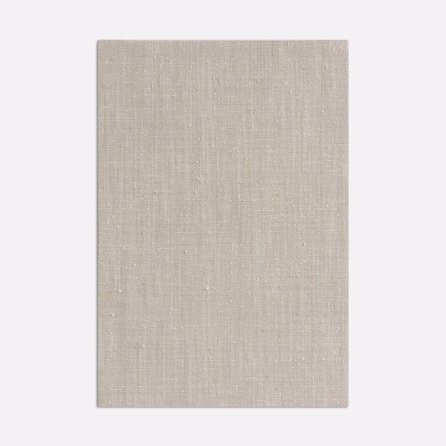 Pale greige curtain fabric with fine vertical slubs and a subtle woven sheen