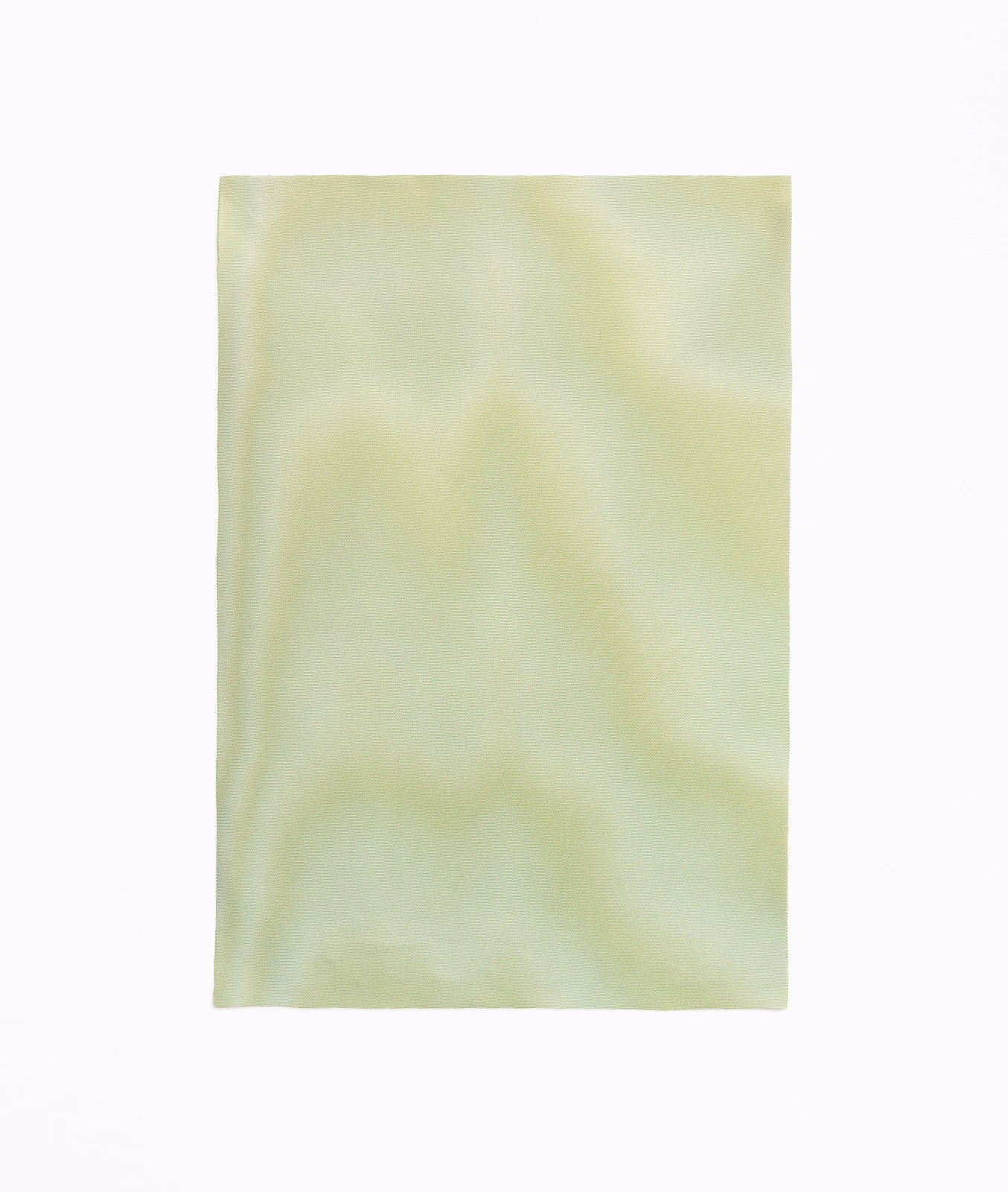 Pale jade curtain fabric with soft clouded green tonal variation and smooth texture