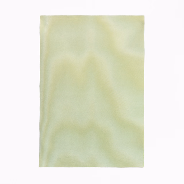 Pale jade curtain fabric with soft clouded green tonal variation and smooth texture