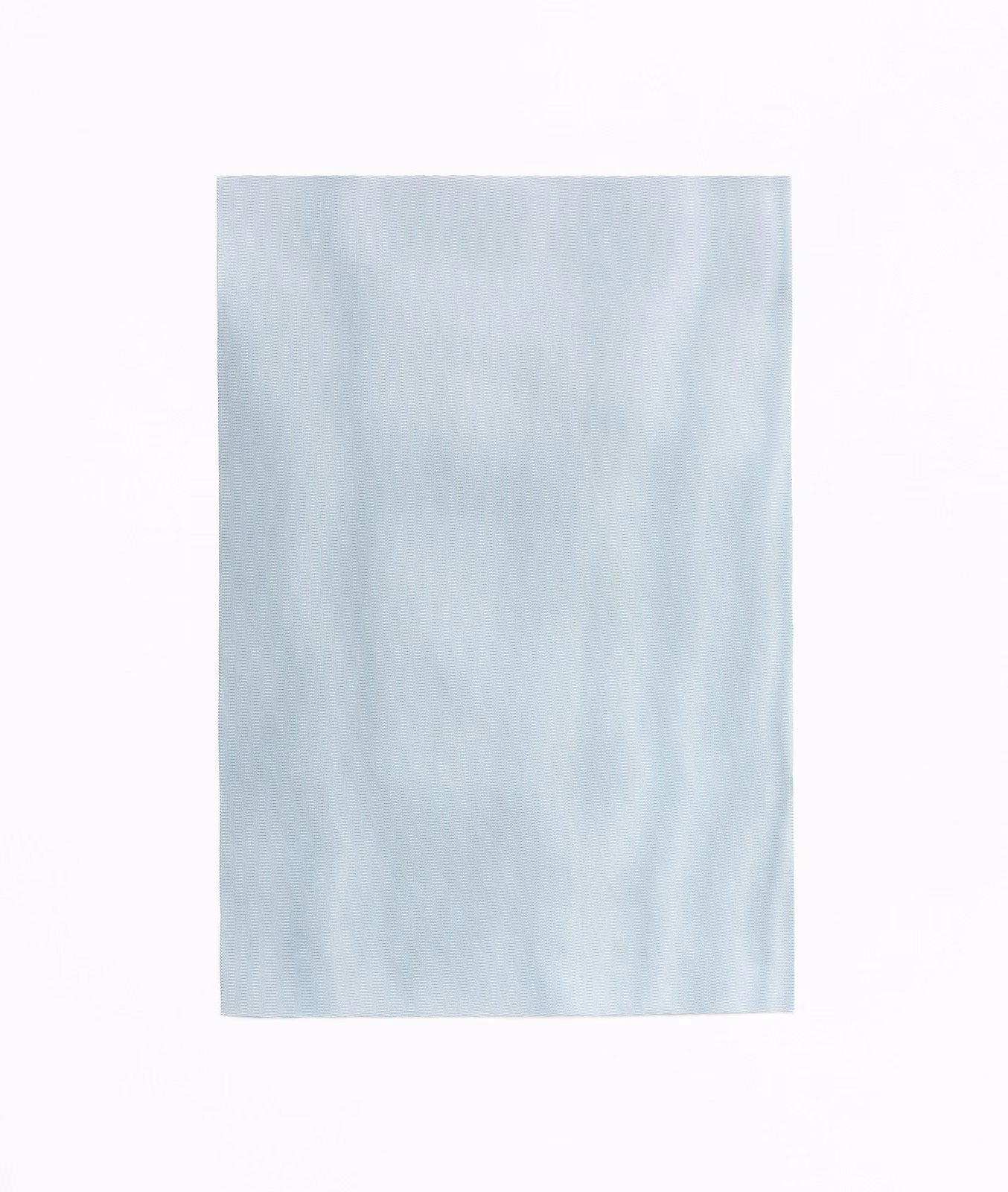 Pale icy blue curtain fabric with soft vertical tonal shading and a smooth surface