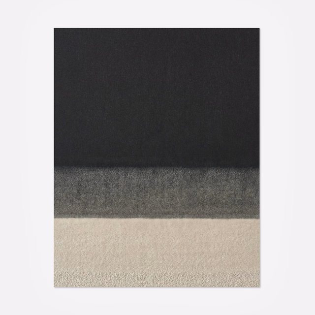 Charcoal, grey and warm ivory horizontal bands with a softly mottled texture