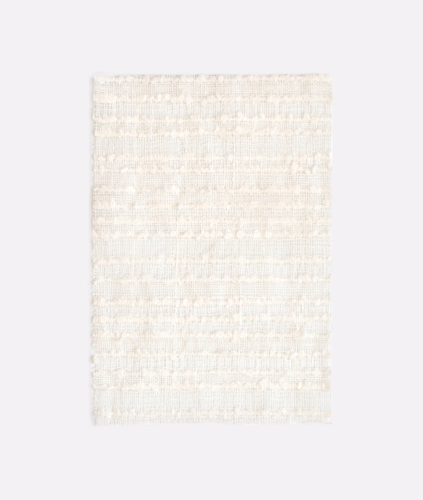 Pale ivory Whitebloom swatch with softly ridged horizontal woven bands