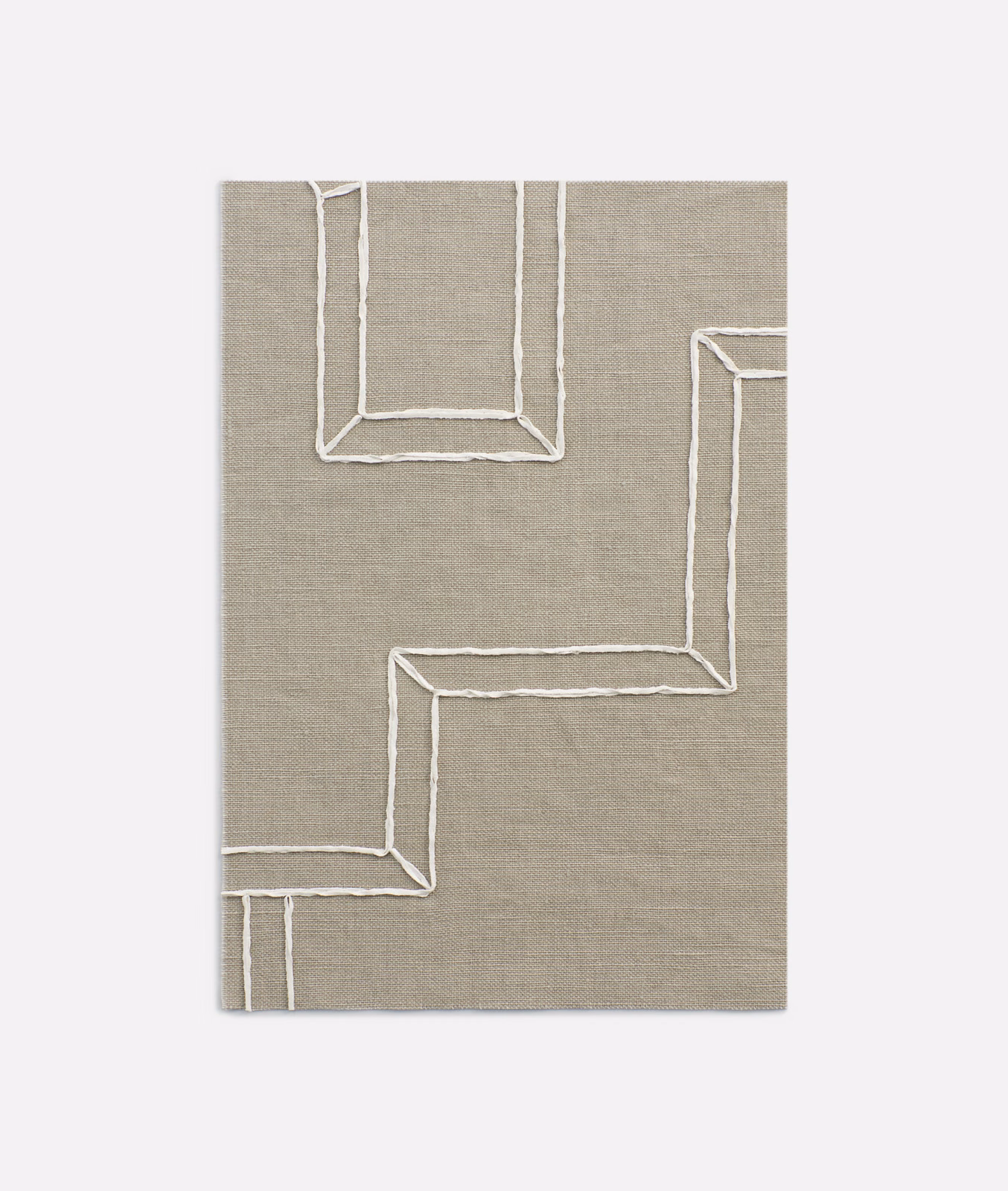 Taupe-grey woven curtain fabric with raised ivory stepped geometric lines