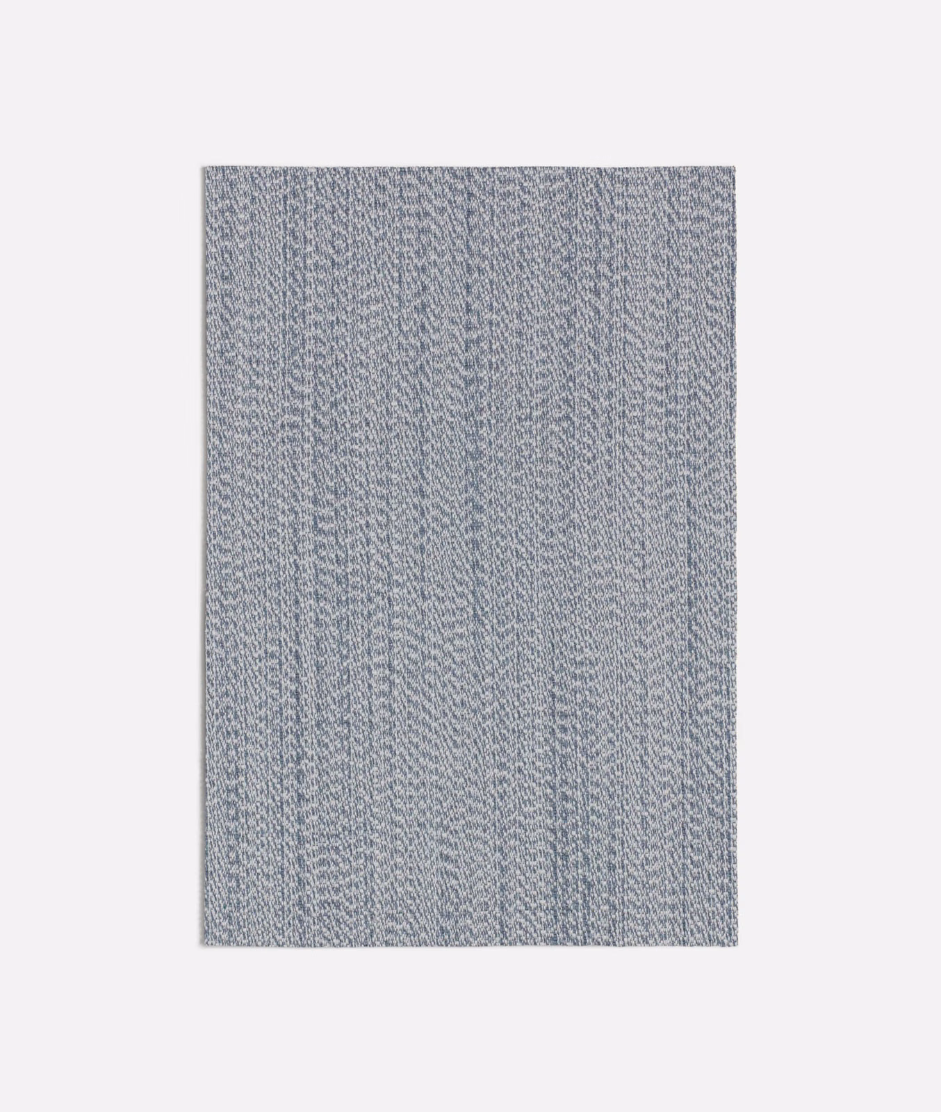 Muted seafoam blue-grey textile with fine vertical striations and softly varied weave