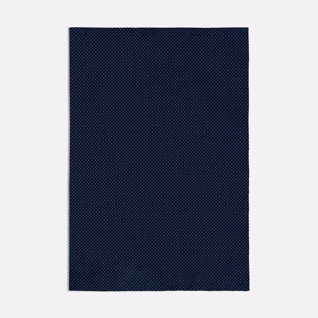 Deep navy Acero Blue swatch with a tiny, evenly textured woven surface