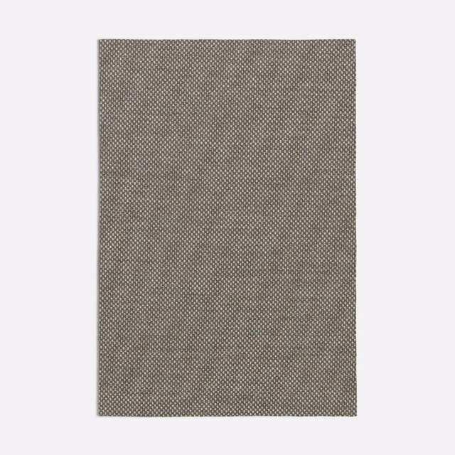 Close view of Acero Grey’s fine taupe-grey micro-patterned woven texture