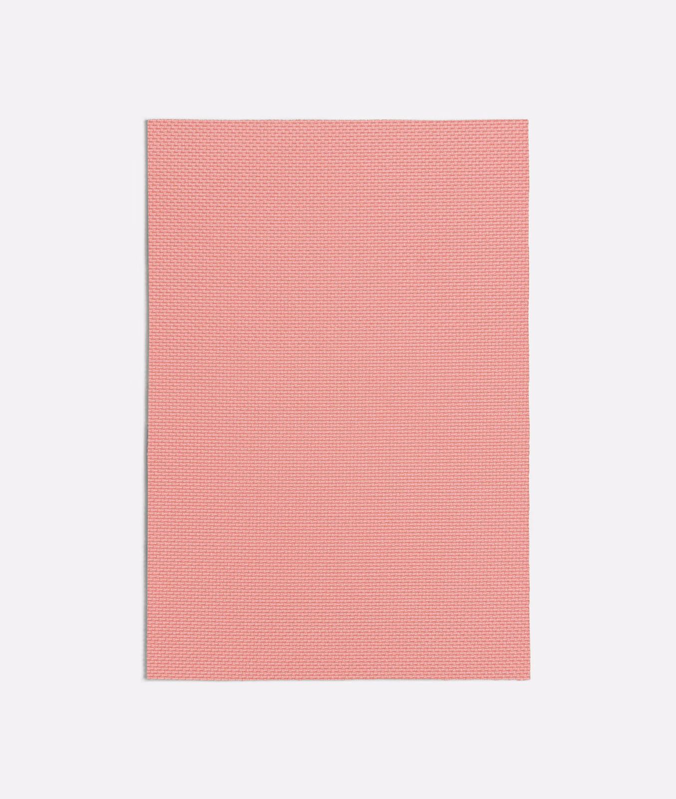 Muted coral-pink fabric swatch showing a fine, tightly textured plain weave