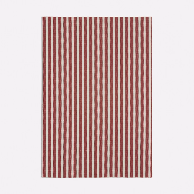 Deep red and cream woven fabric with narrow vertical stripes