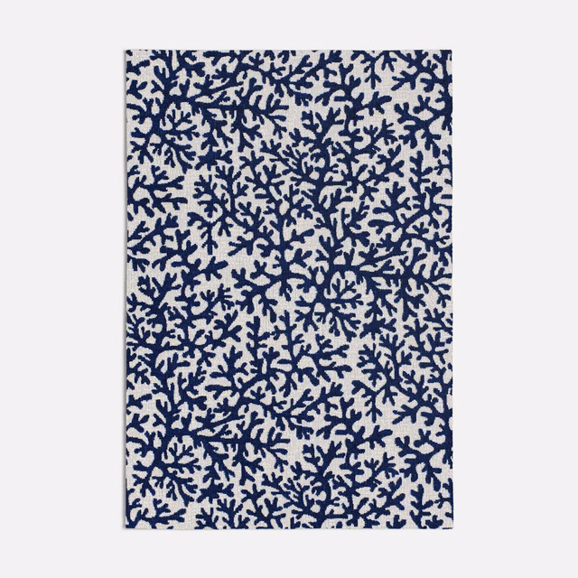 Cream fabric with dense ink-blue branching coral motif in a small-scale repeat