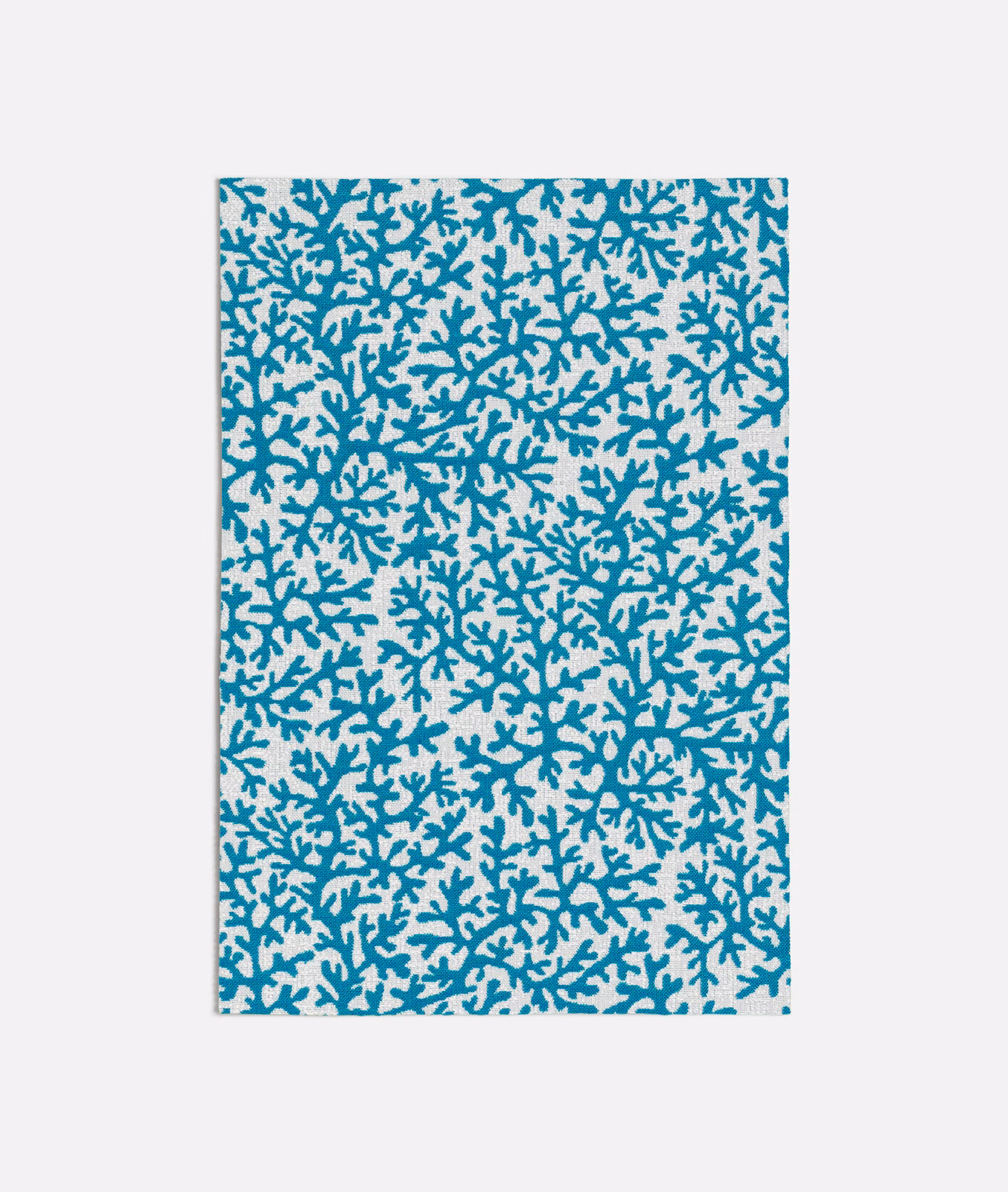 Dense cool turquoise coral branches scattered across a pale smooth fabric ground