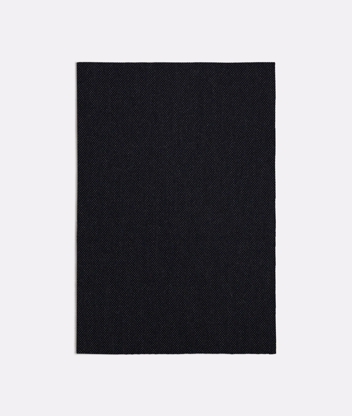 Near-black charcoal fabric with a fine, tightly woven diagonal-textured surface