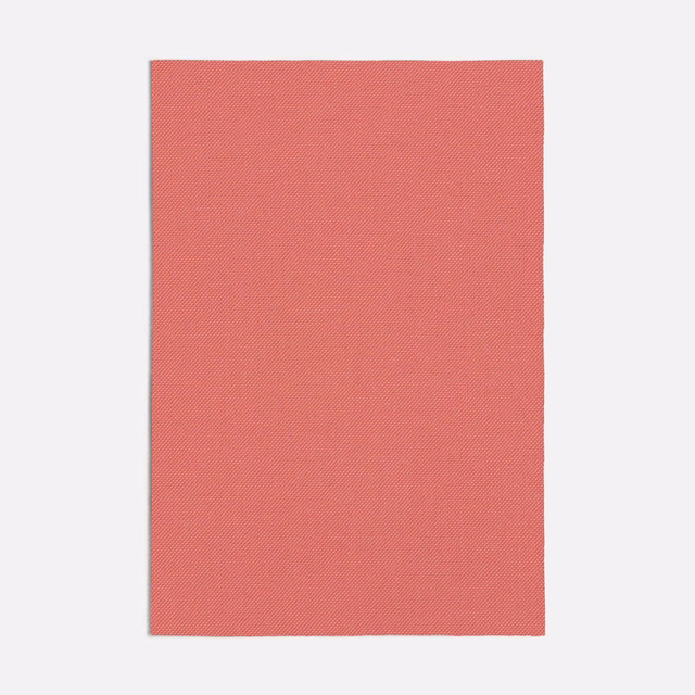 Muted coral-peach swatch with a fine diagonal woven texture