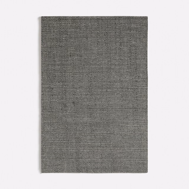Close view of Ash Dark Grey's tight, fine charcoal-grey woven texture