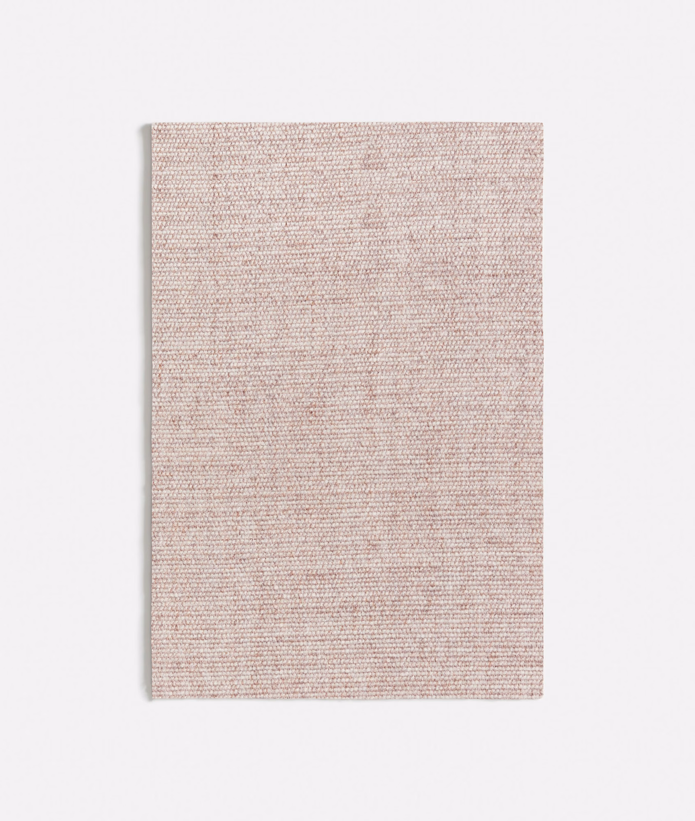 Close view of finely woven muted ash-pink textile with a softly flecked surface