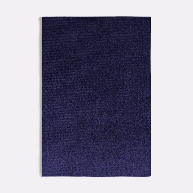 Deep indigo-blue swatch with subtle violet shading and a fine, softly textured surface