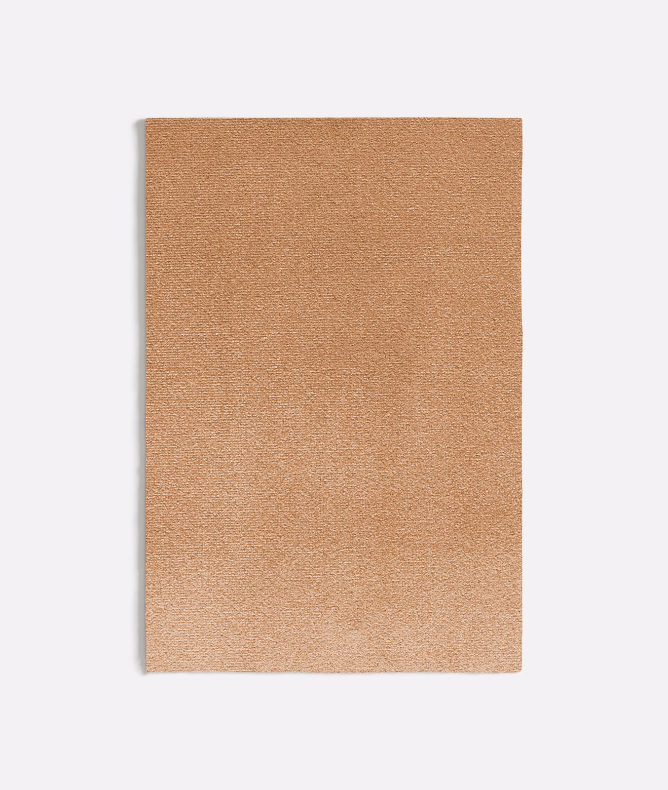 Muted peach-pink plain fabric swatch with a fine softly varied woven texture