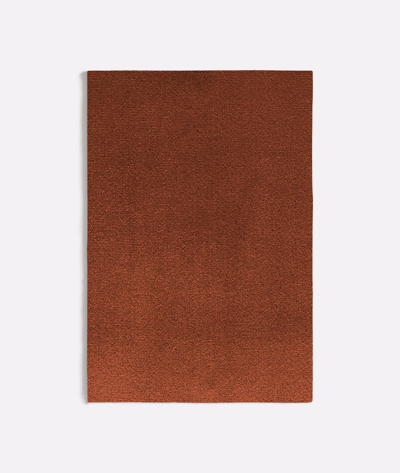 Close-up of warm red-brown Augusta Terracotta fabric with a fine, subtly grainy weave