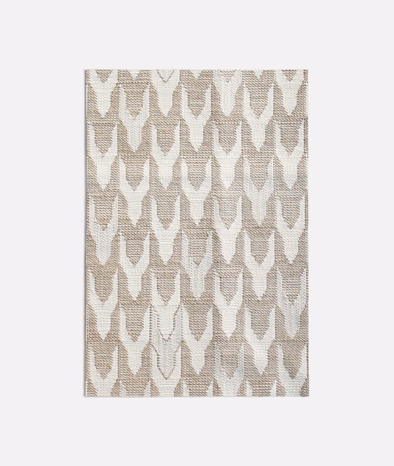 Warm beige and ivory woven fabric with repeating pointed geometric motifs
