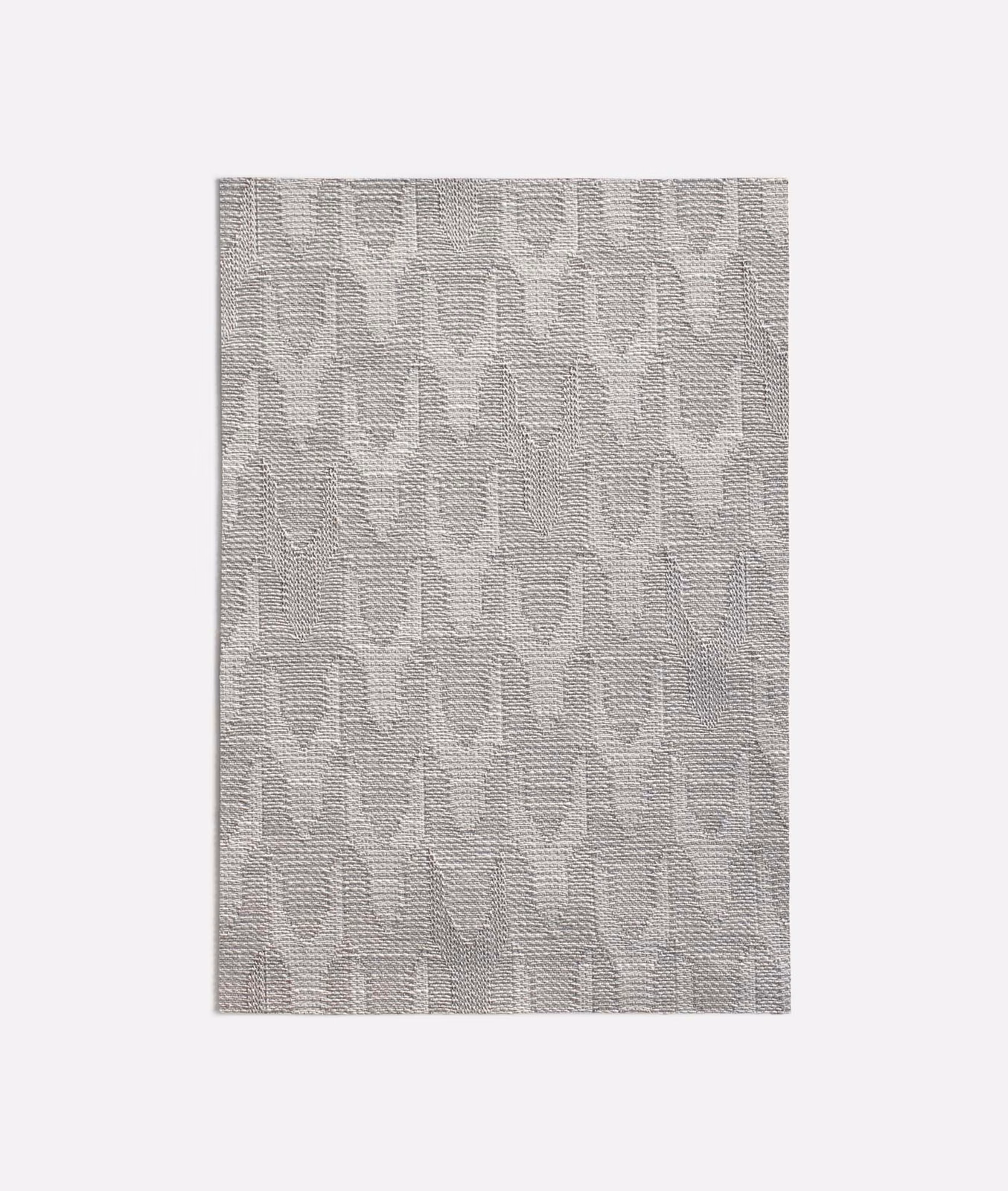 Pale silver-grey woven swatch with a subtle repeating geometric pattern and textured surface
