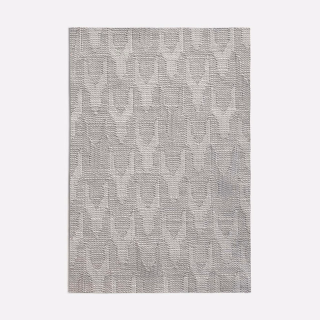 Pale silver-grey woven swatch with a subtle repeating geometric pattern and textured surface