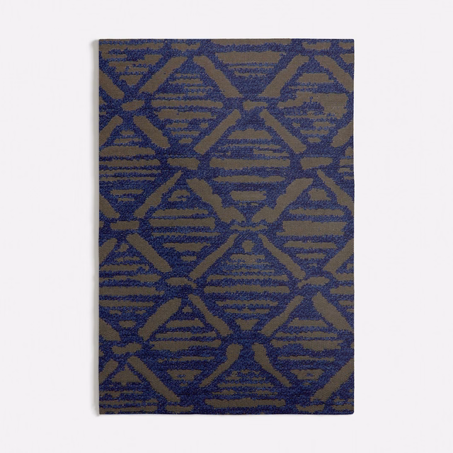Olive woven textile with dark blue interlocking diamonds and horizontal stripe textures