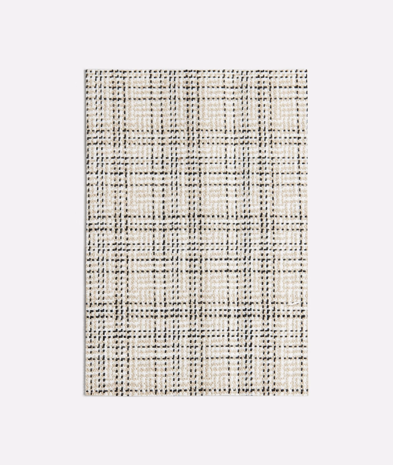 Ivory woven swatch with irregular black grid lines and charcoal flecks