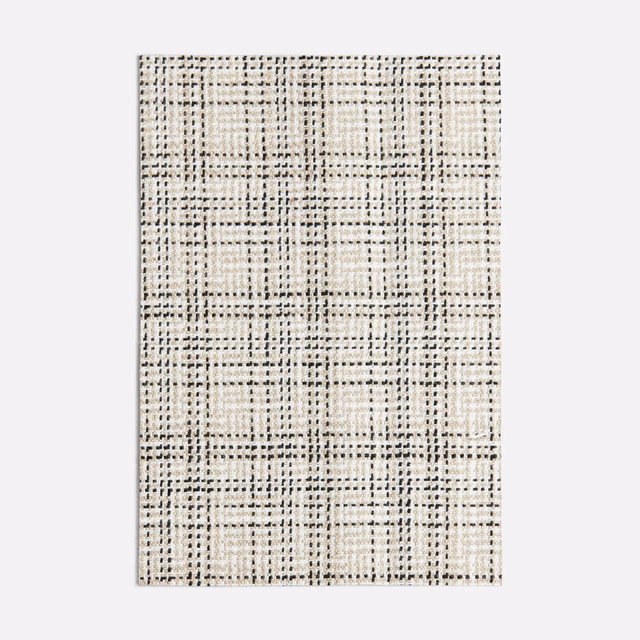Ivory woven swatch with irregular black grid lines and charcoal flecks