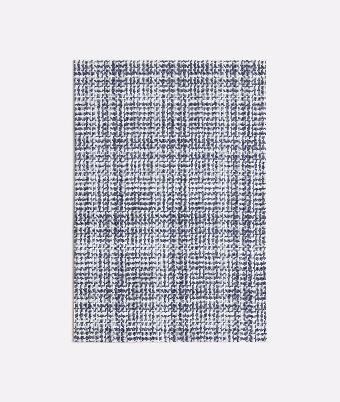 Cool blue-grey woven check with pale flecks and a softly irregular textured surface