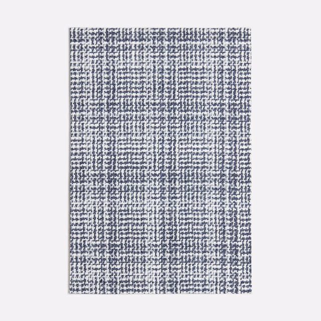Cool blue-grey woven check with pale flecks and a softly irregular textured surface