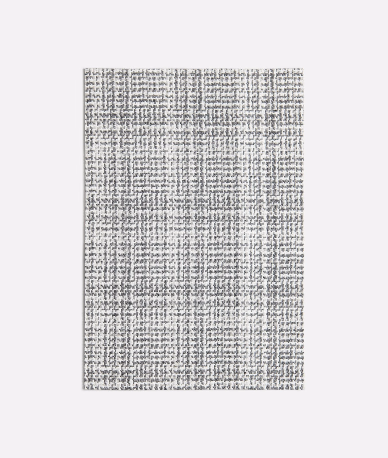 Cool grey woven swatch with charcoal flecks and an irregular fine grid