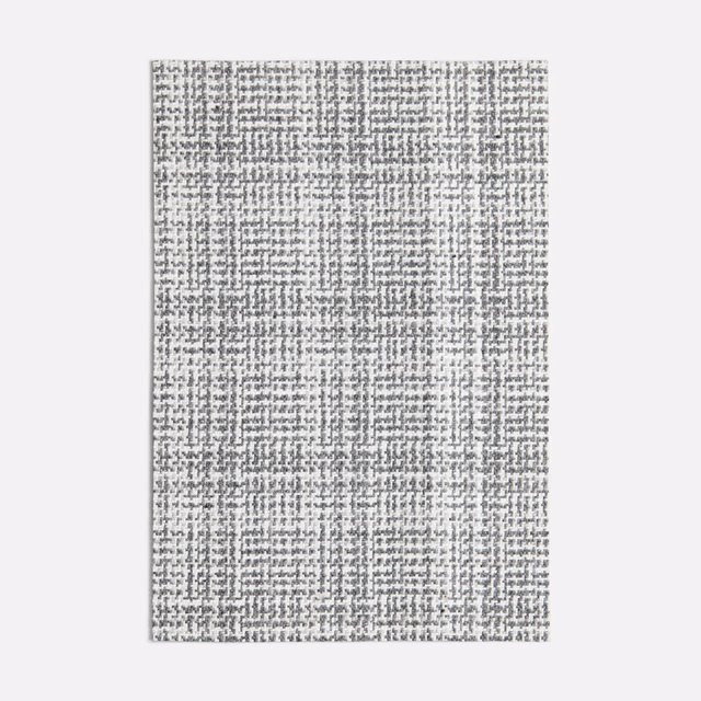 Cool grey woven swatch with charcoal flecks and an irregular fine grid