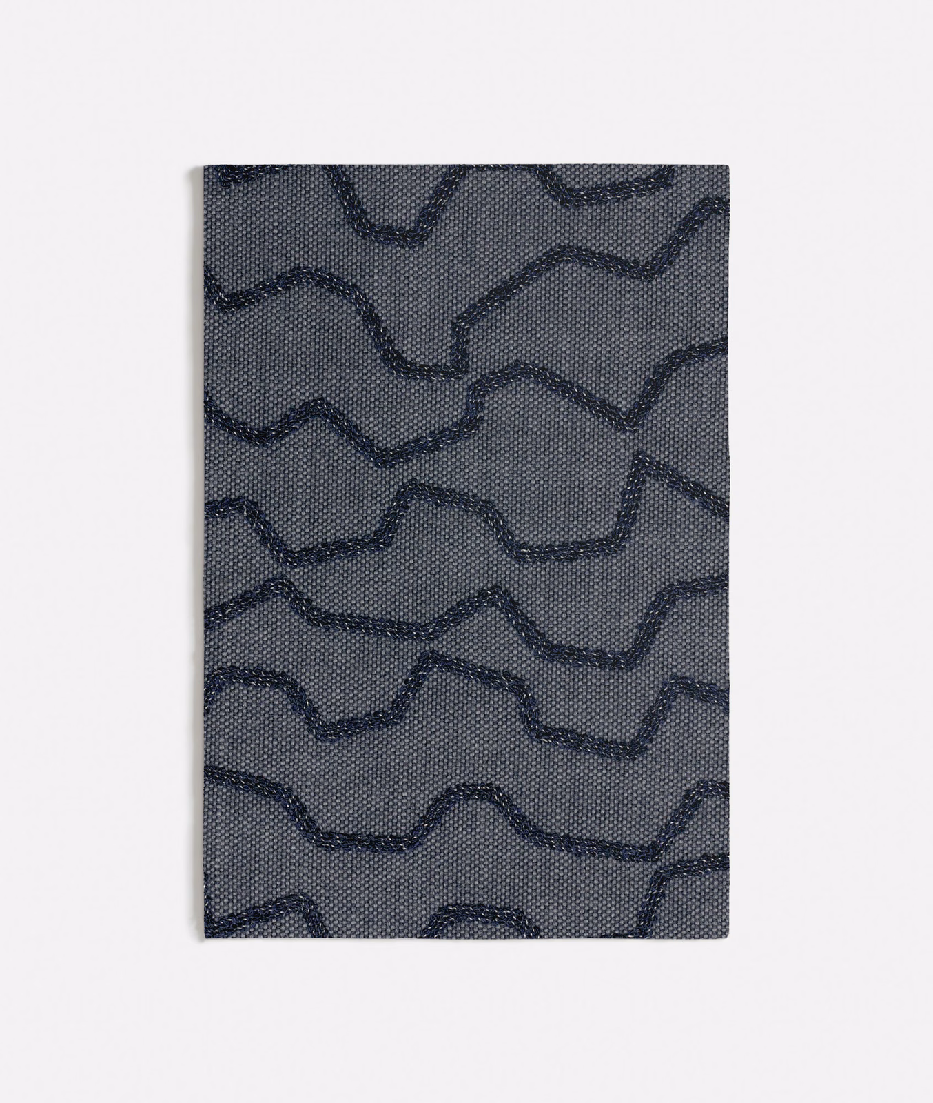 Cool blue-grey woven swatch with dark navy irregular wave lines and dotted texture