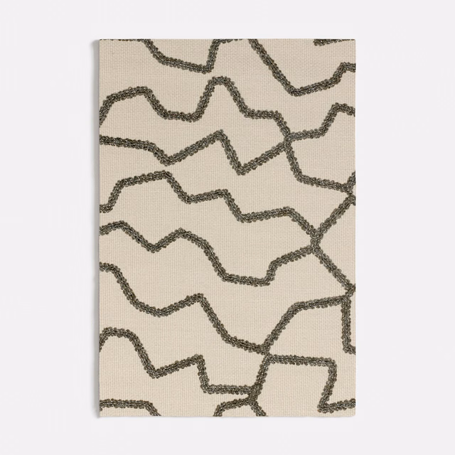 Ivory fabric swatch with irregular olive-green looping lines and a softly textured surface