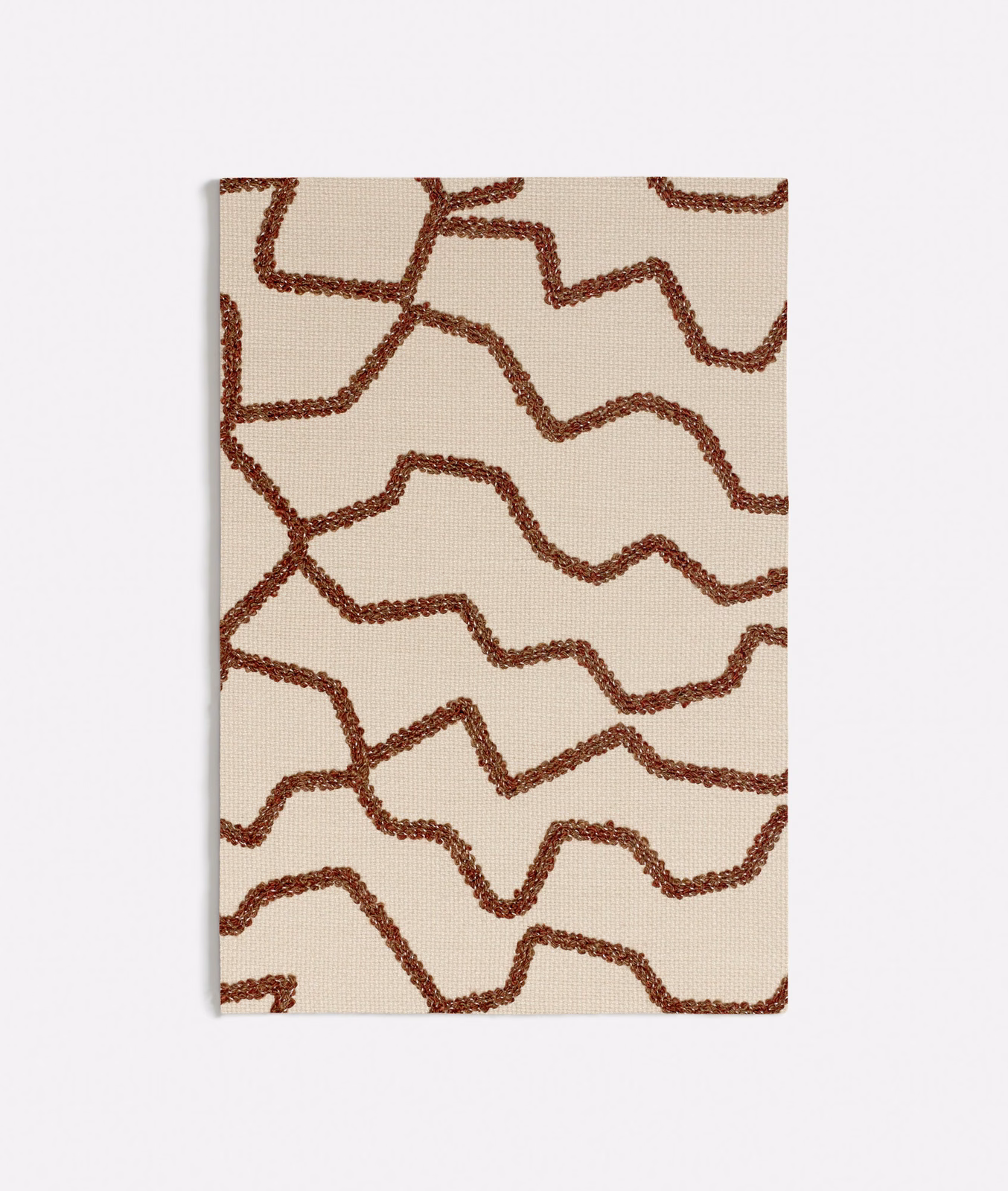 Warm cream textile with raised rust-brown meandering lines and fine woven texture